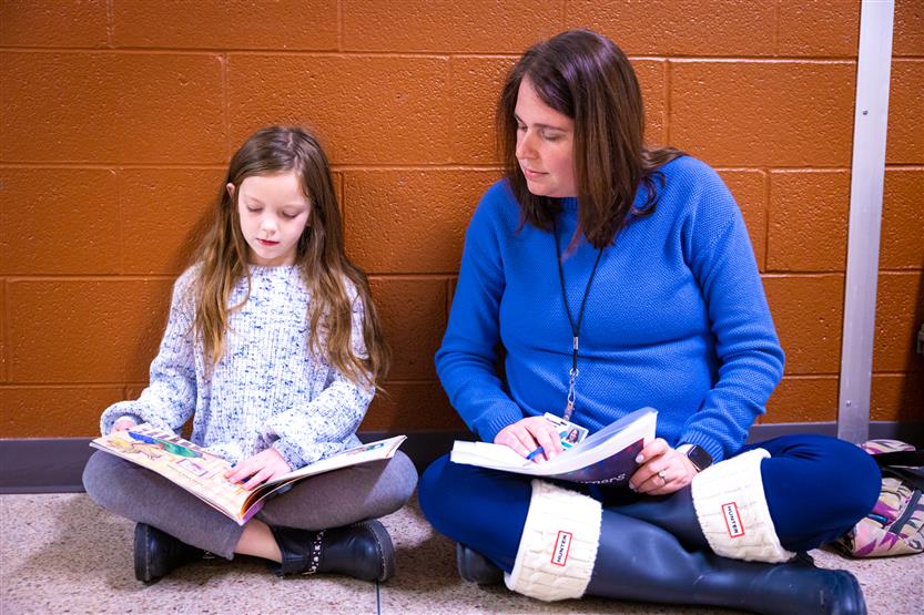 Students read to volunteers